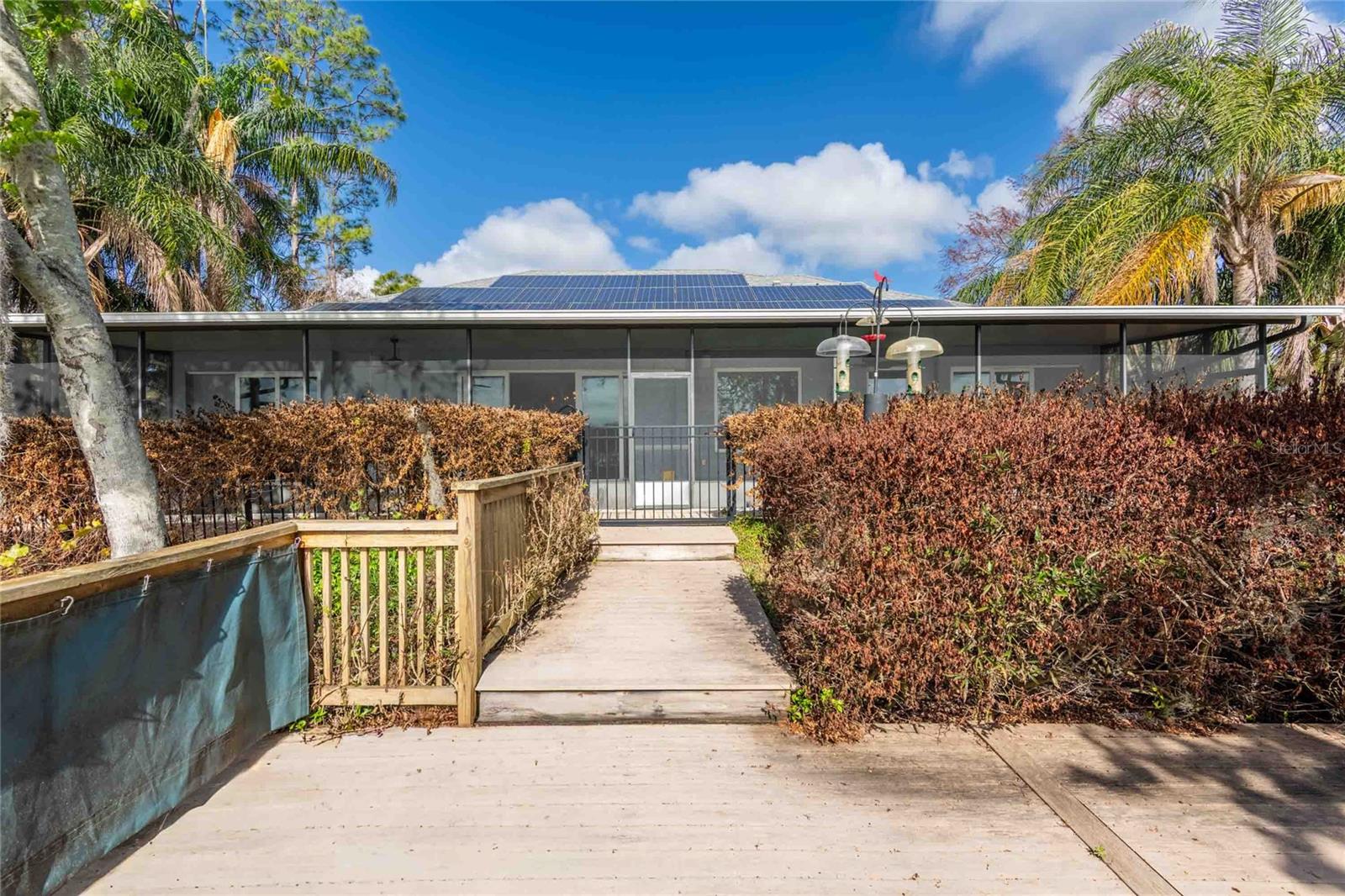 Back with solar panels and entry to dock and lake