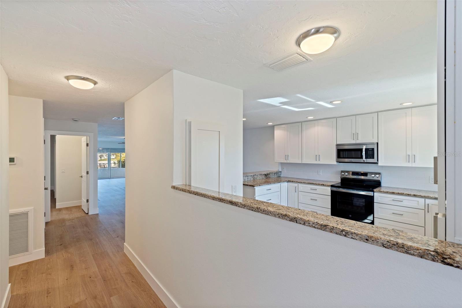 Entrance with kitchen view