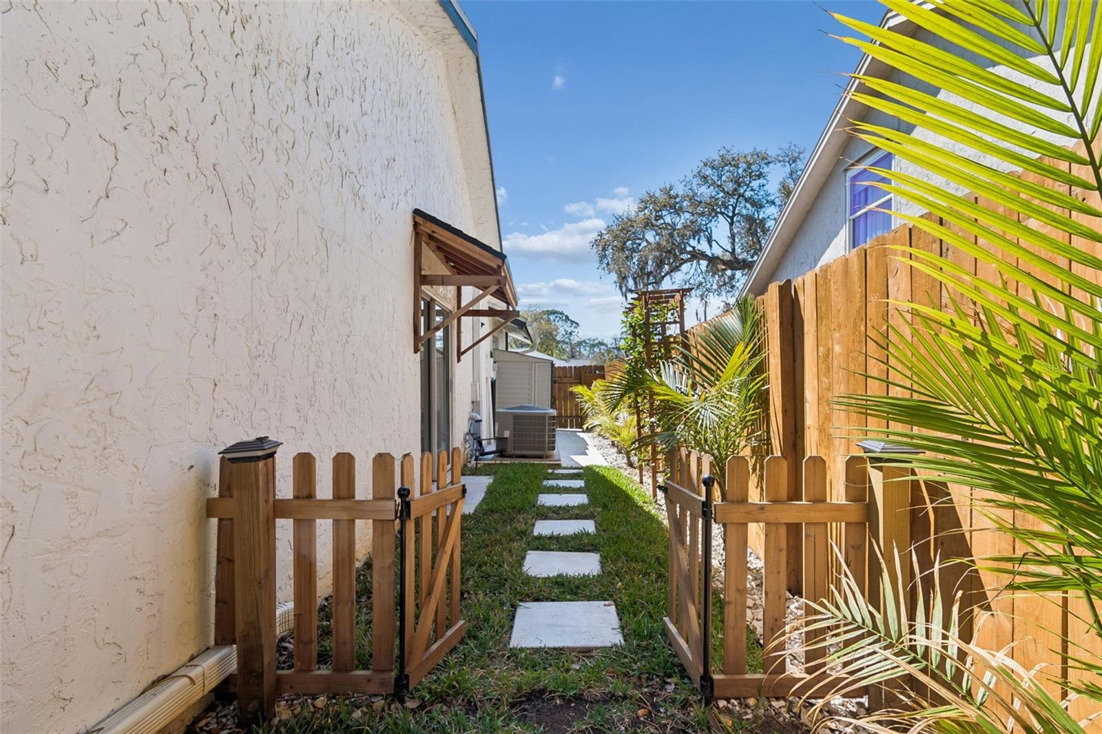 Make this space your own, with a garden box or as a dog run with the picket fence and everything