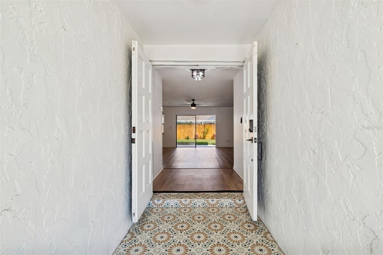How inviting does this entrance look where you can see all the way to the backyard oasis