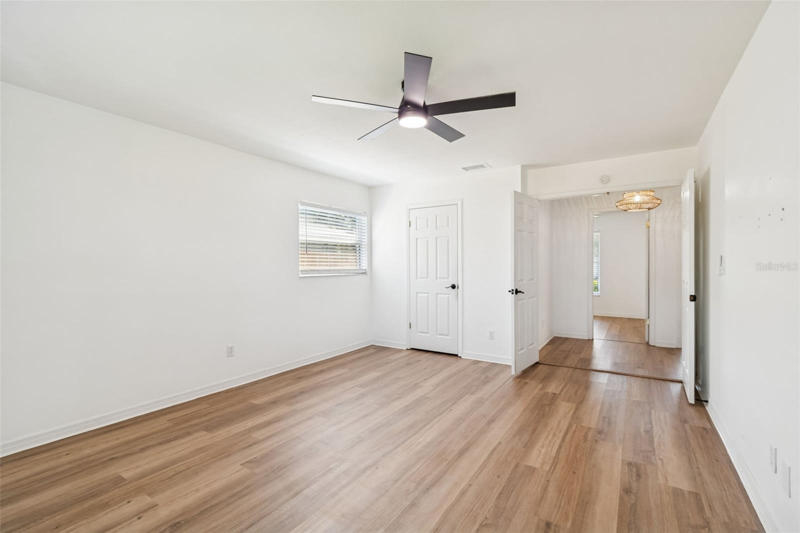 Wake up to garden views and lots of natural light in the primary bedroom