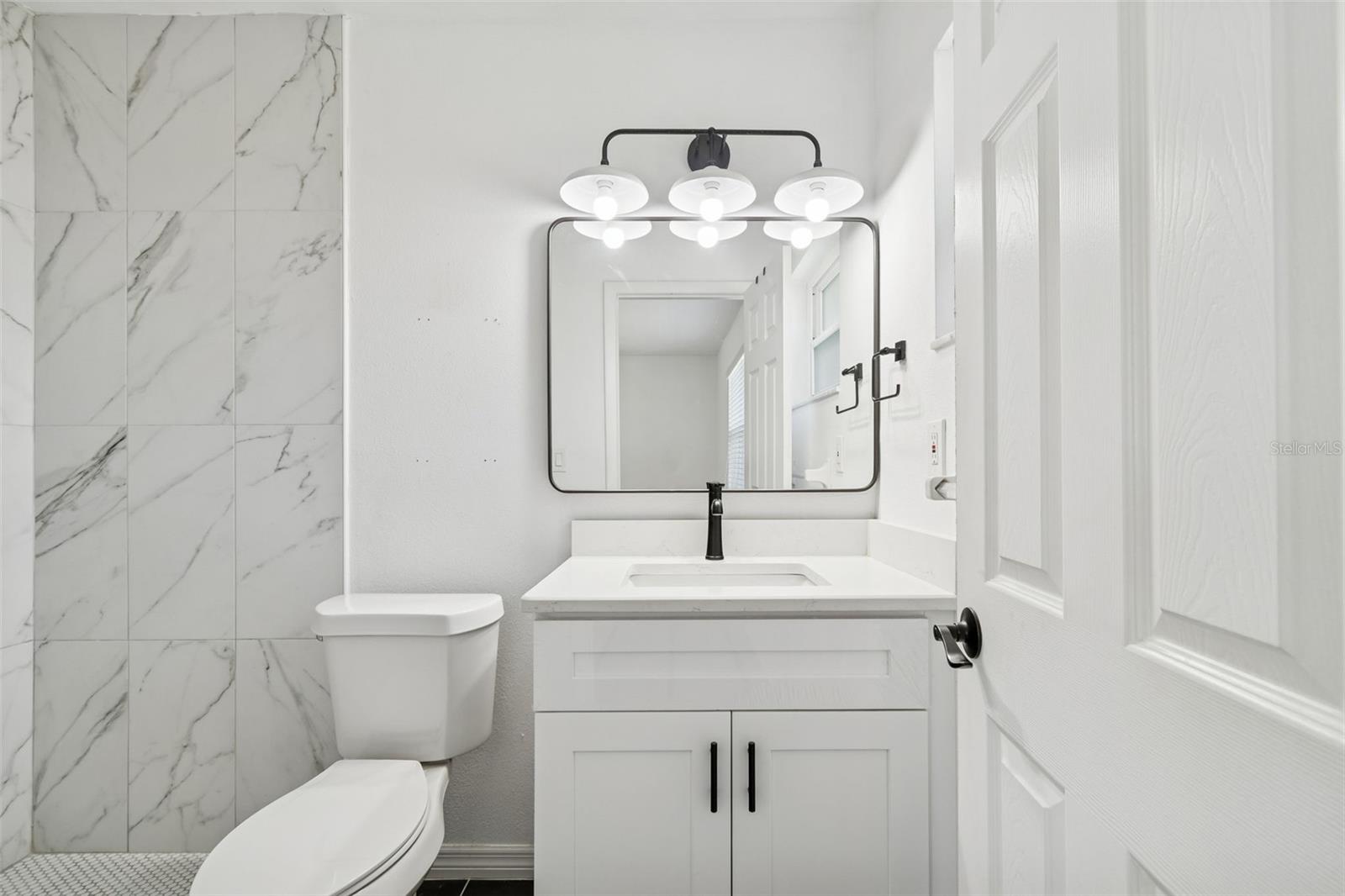 Well appointed primary bathroom with