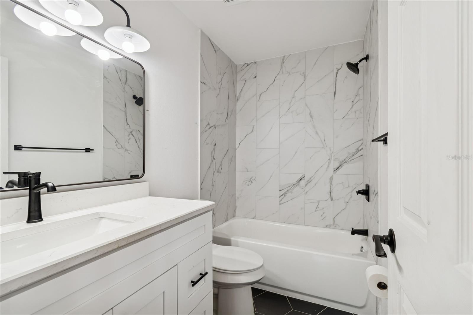 Spacious guest bath is sure to impress