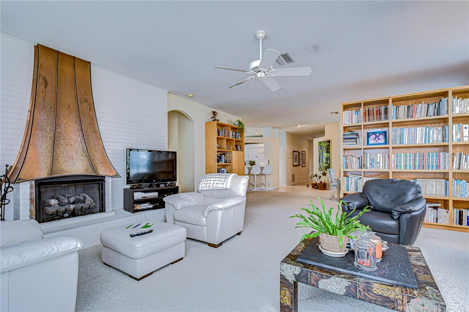 Gas fireplace with copper flue (living room focal point)