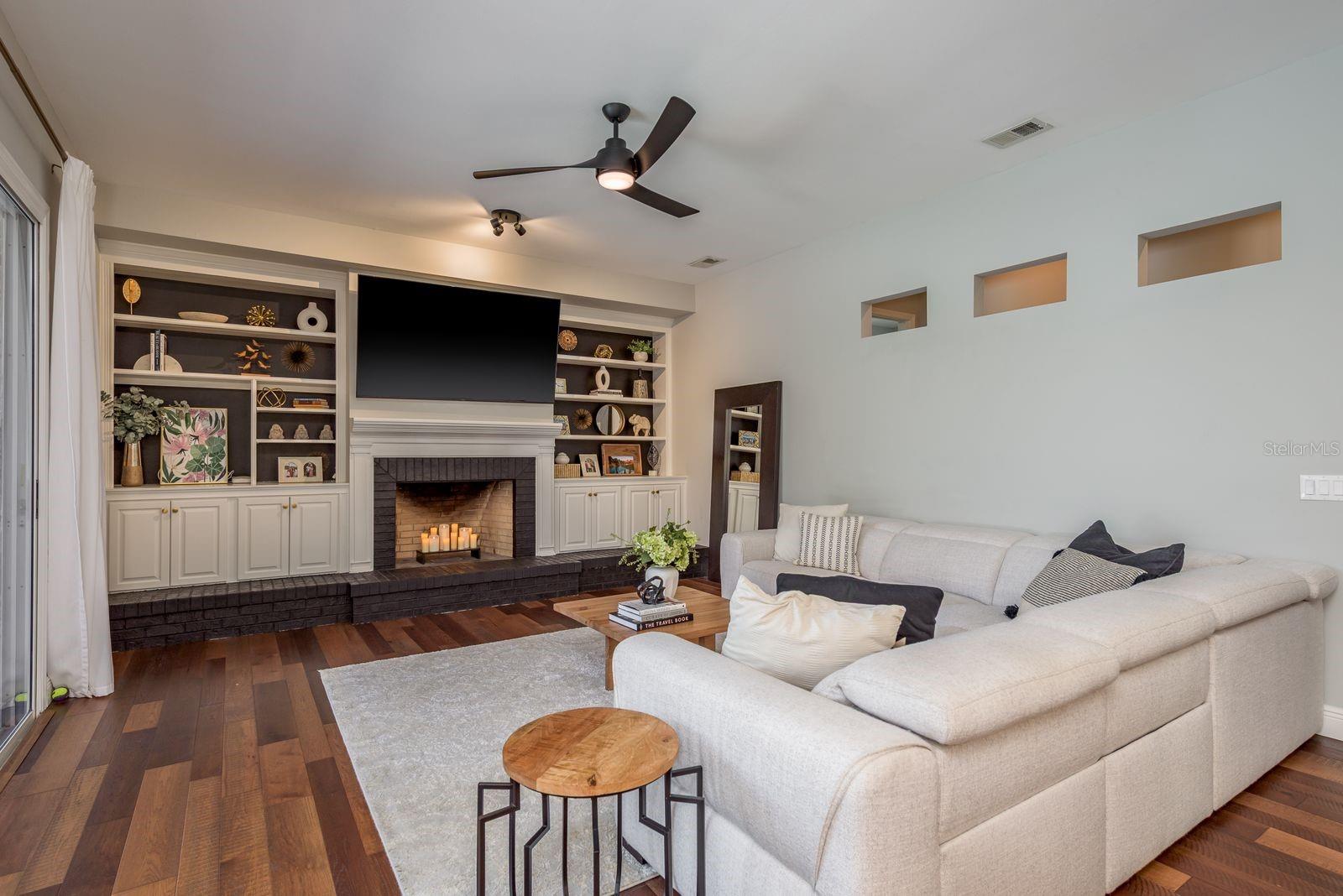 Family room with woodburning fireplace