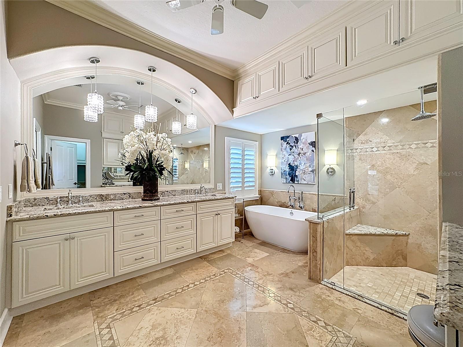 Beautifully updated primary bathroom with ample storage