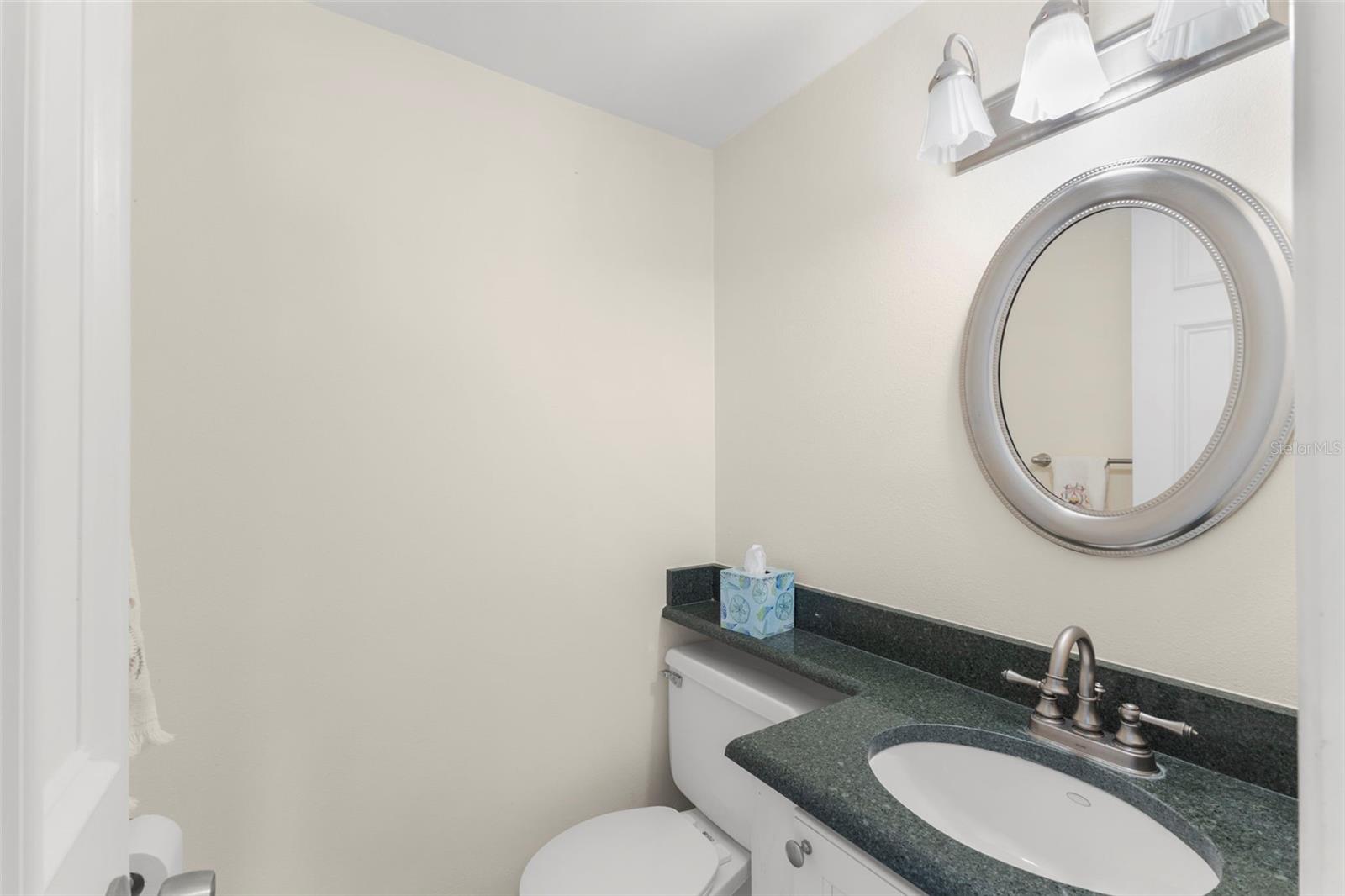 HALF BATH OFF OF LIVING ROOM