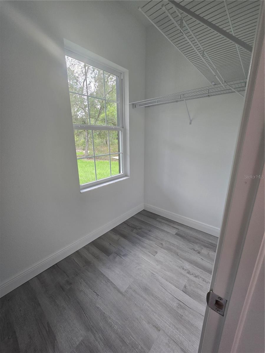 LARGE WALK-IN CLOSET WITH A WINDOW