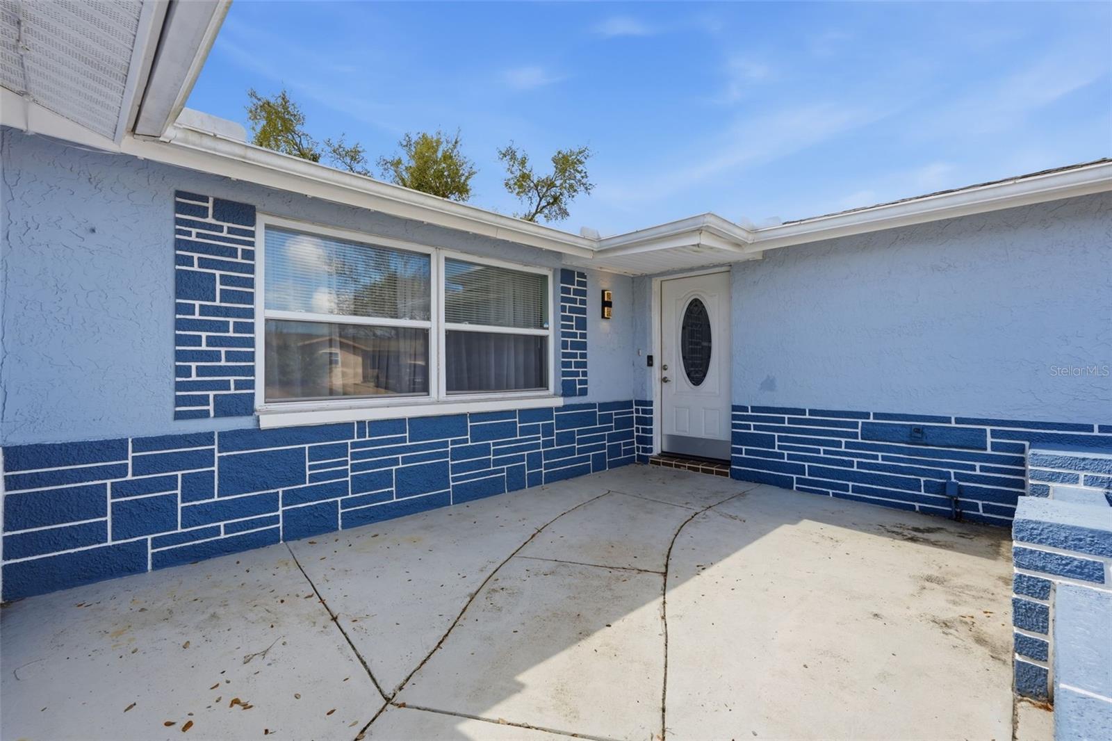 Huge front Porch area-partially enclosed