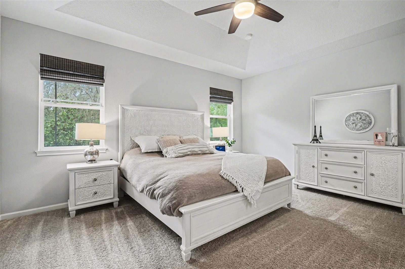 Primary Suite w/ Tray Vault Ceiling, Windows overlook the huge lanai!