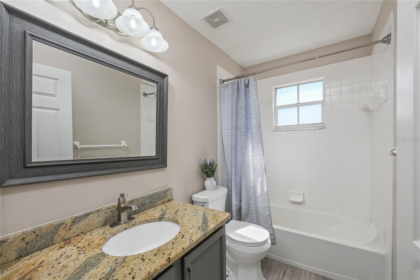 Bathroom 2 is updated and perfectly situated between bedrooms 2 and 3
