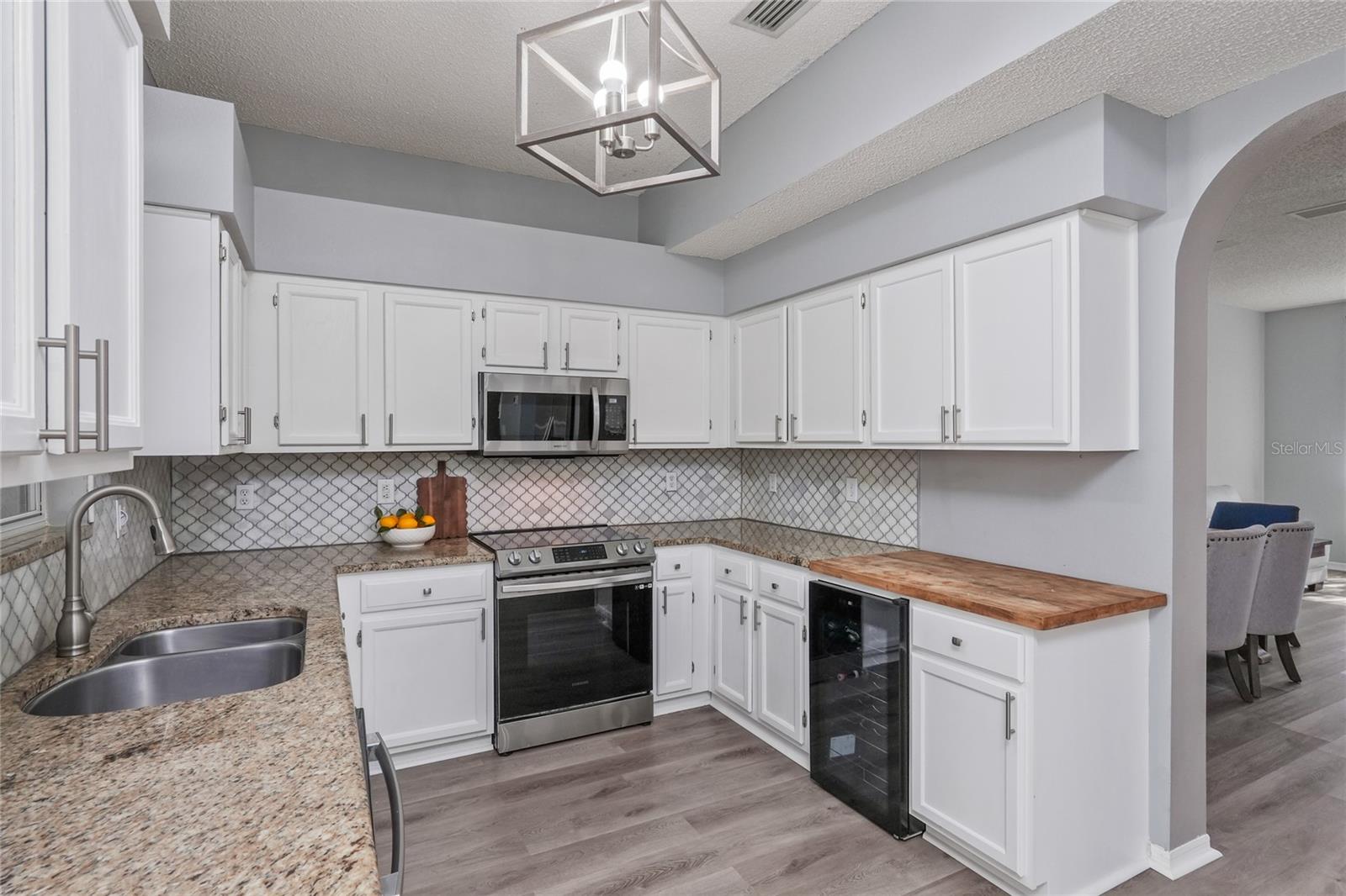 Kitchen with lots of counter space and views of the pool