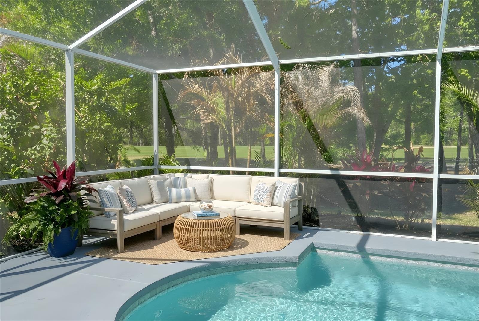 Virtually Staged - Sitting area with fresh landscaping for privacy