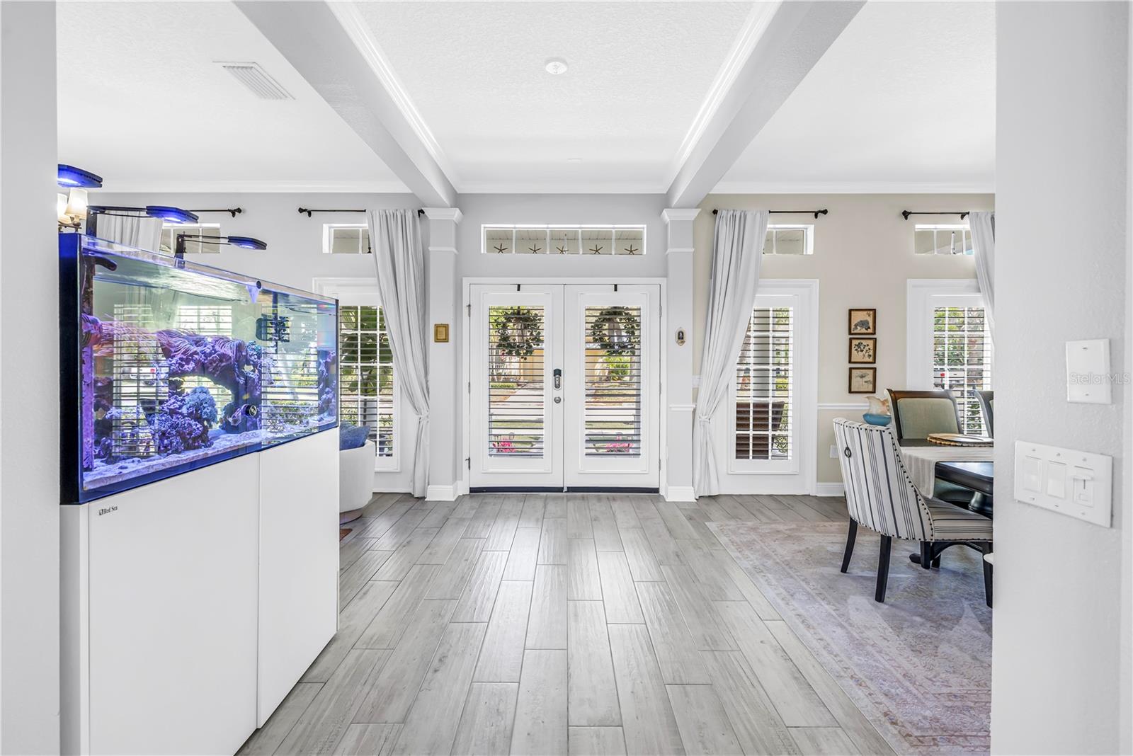 Natural Light floods the front of the home through plantation shutters