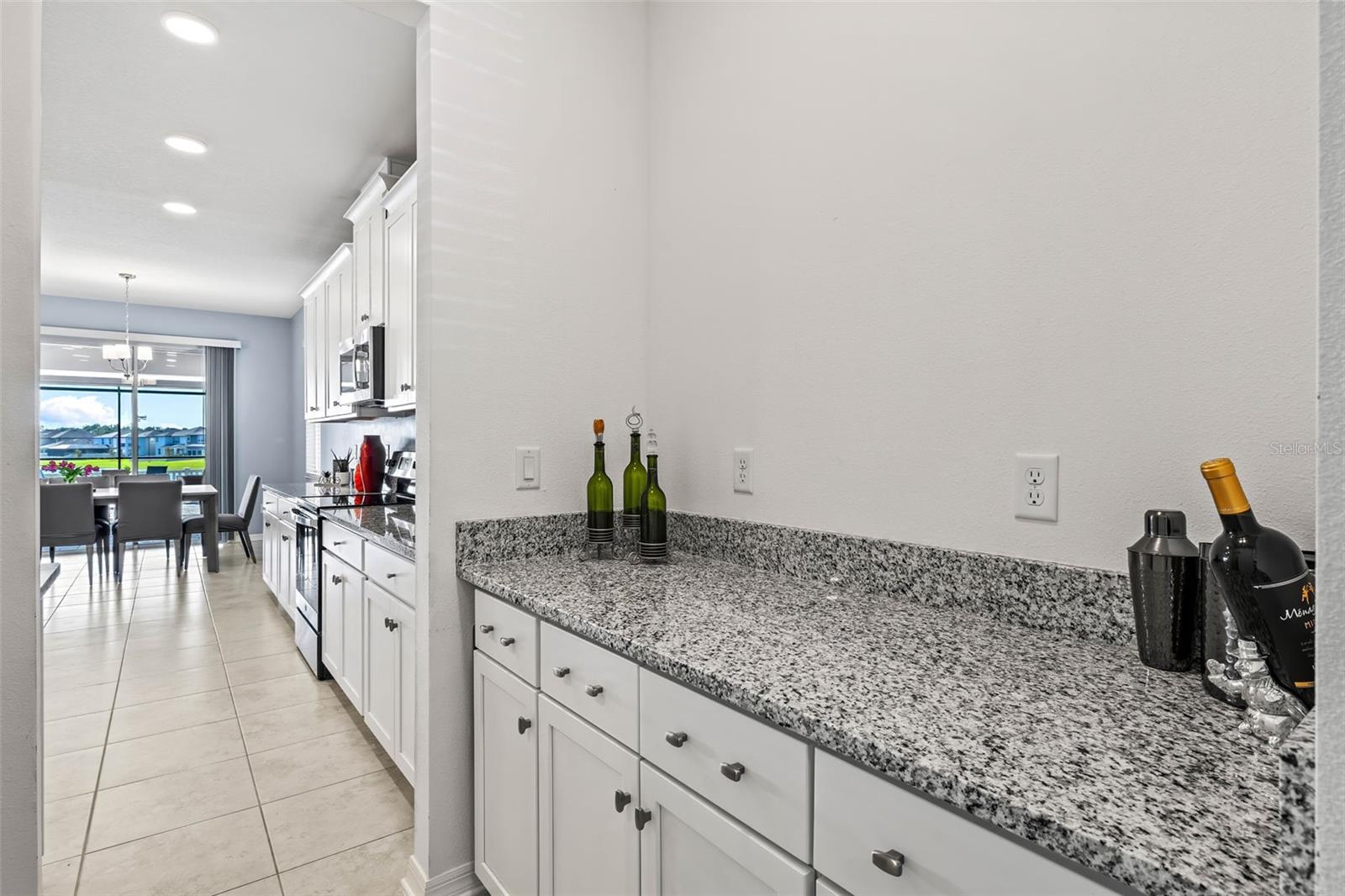 Upgraded Butler Pantry with Granite and Cabinetry