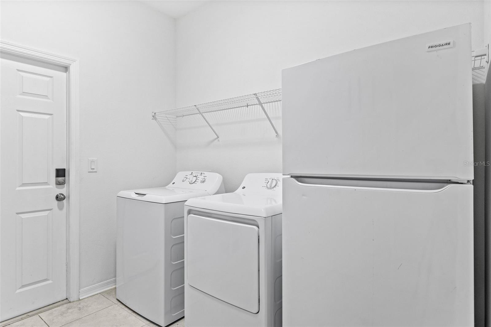 Laundry Room with Washer and Dryer.  White Refrigerator DOES NOT CONVEY