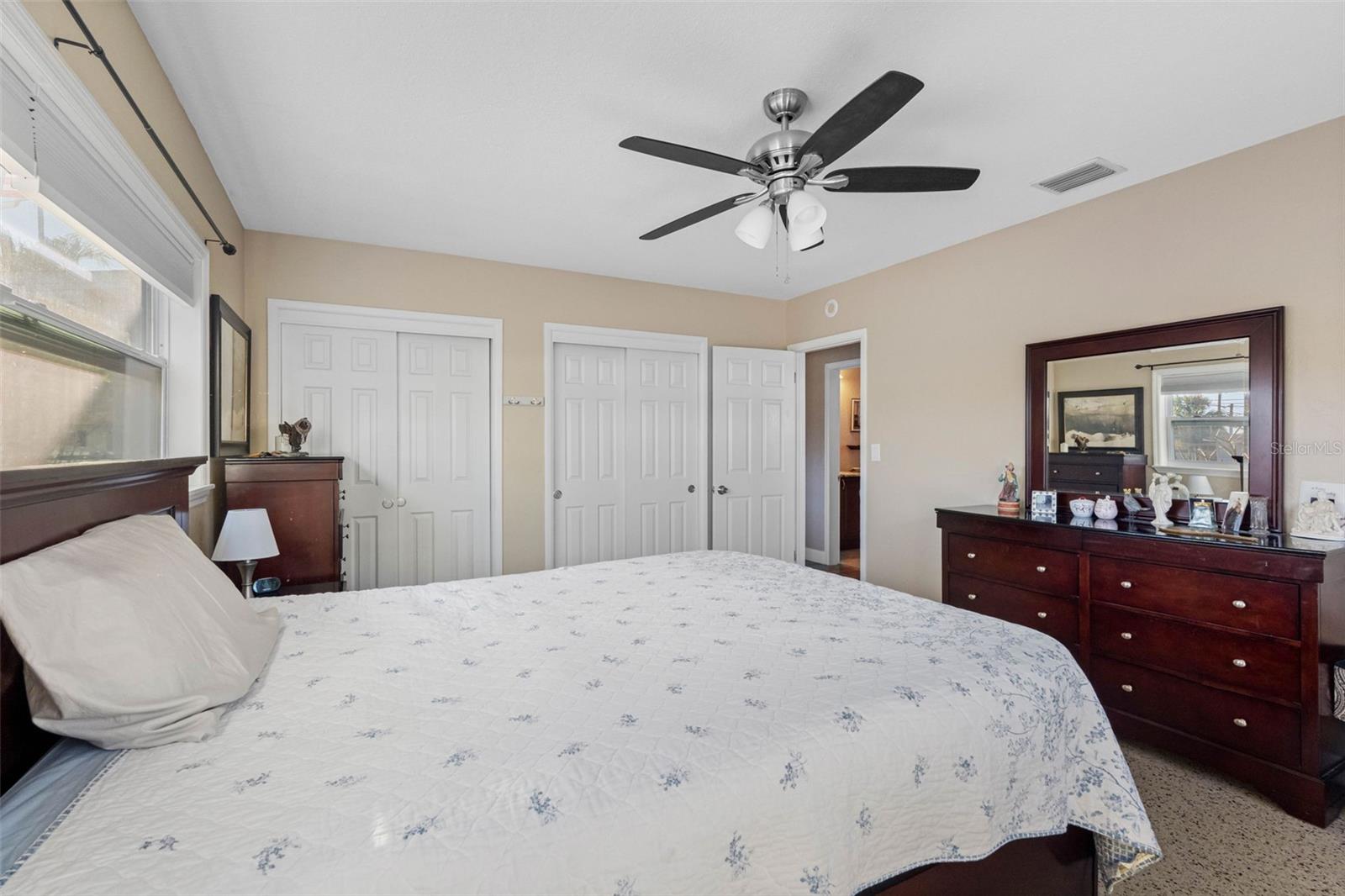 ... Primary / Master Bedroom with Ten Foot run of Closet Space. Room Size 15.6 X 12.9. New Doors - New Windows - Ceiling Fan - Polished Terrazzo Floors..