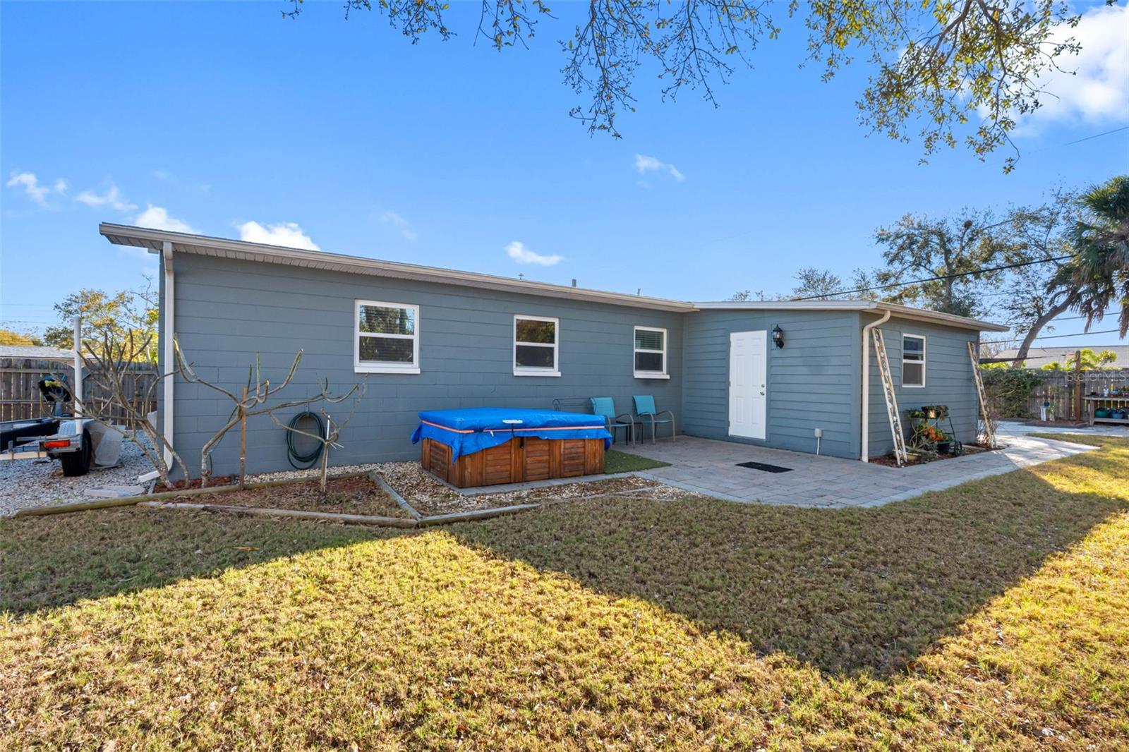 .. Is That a hot Tub.. White Door from Home Office to Back Yard. East side of Yard.