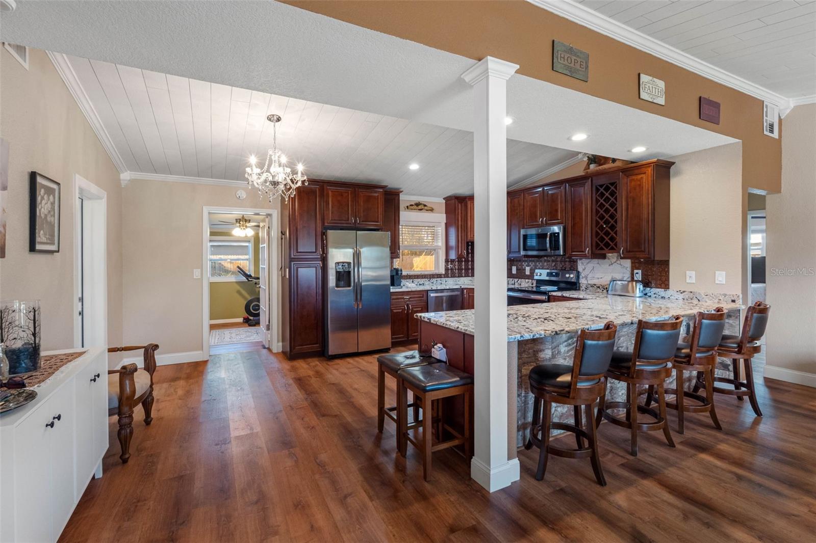 ... Kitchen Shot #1 ....Open Kitchen Layout w/ Vaulted Ceilings   22.6 X 15.2... Solid Wood Cabinetry - Granite - Appliances - Extremely move in ready! Home Office Thru open Doorway behind Kitchen.