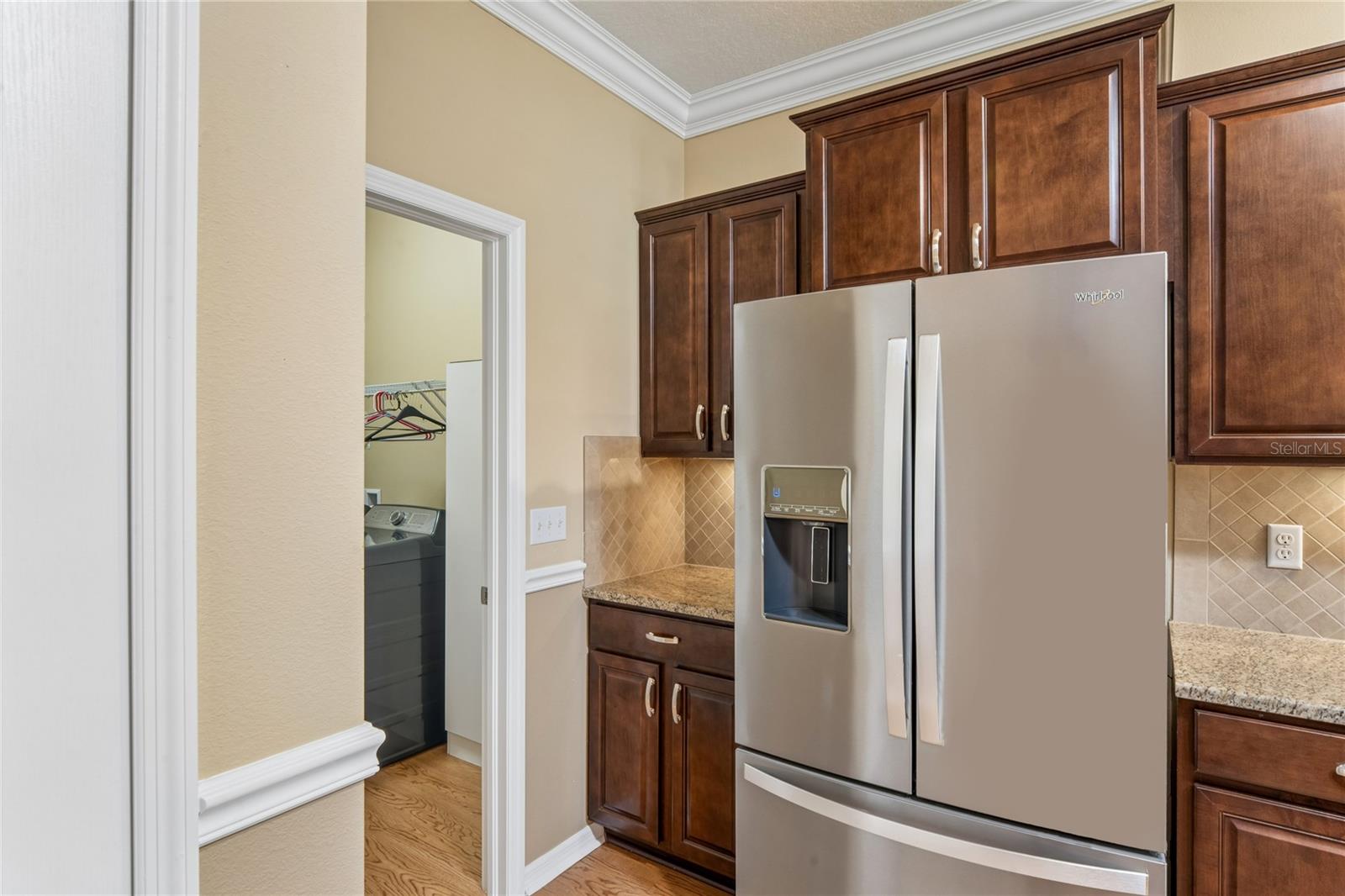 CONVENIENT LAUNDRY ROOM OFF KITCHEN