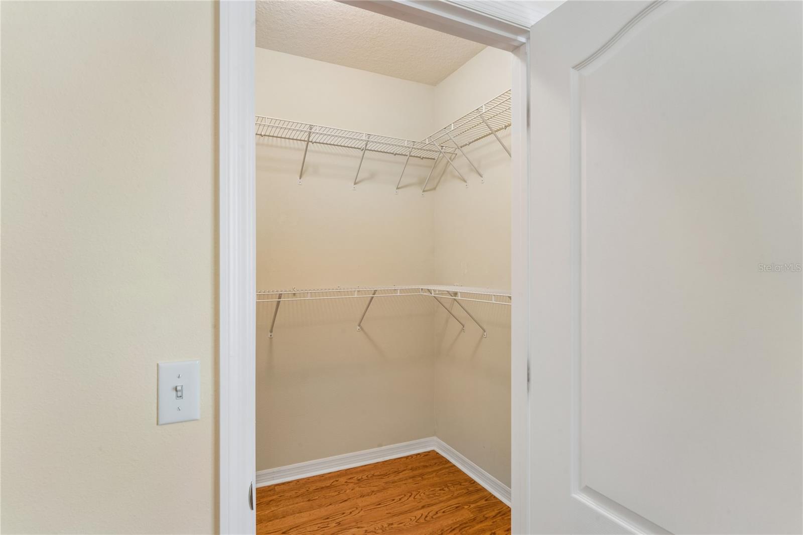 WALK IN CLOSET IN PRIMARY BEDROOM