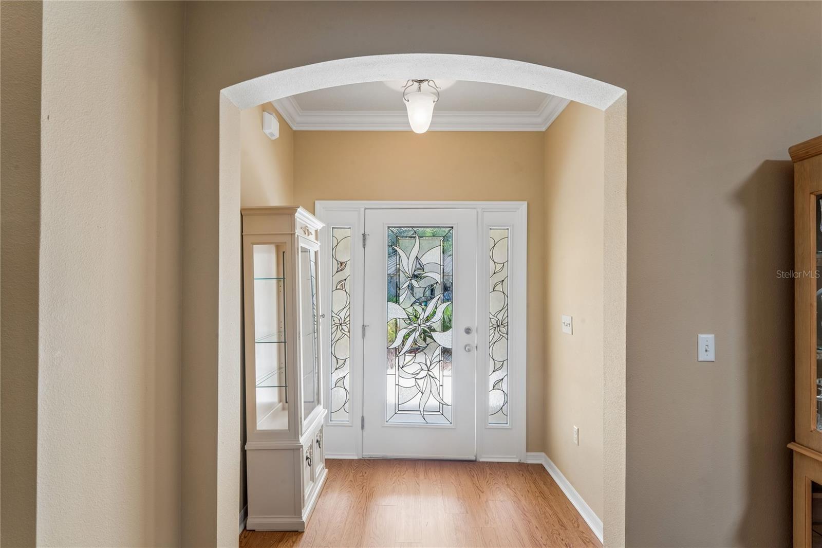 FOYER SHOWING BEAUTIFUL LEADED GLASS FRONT DOOR