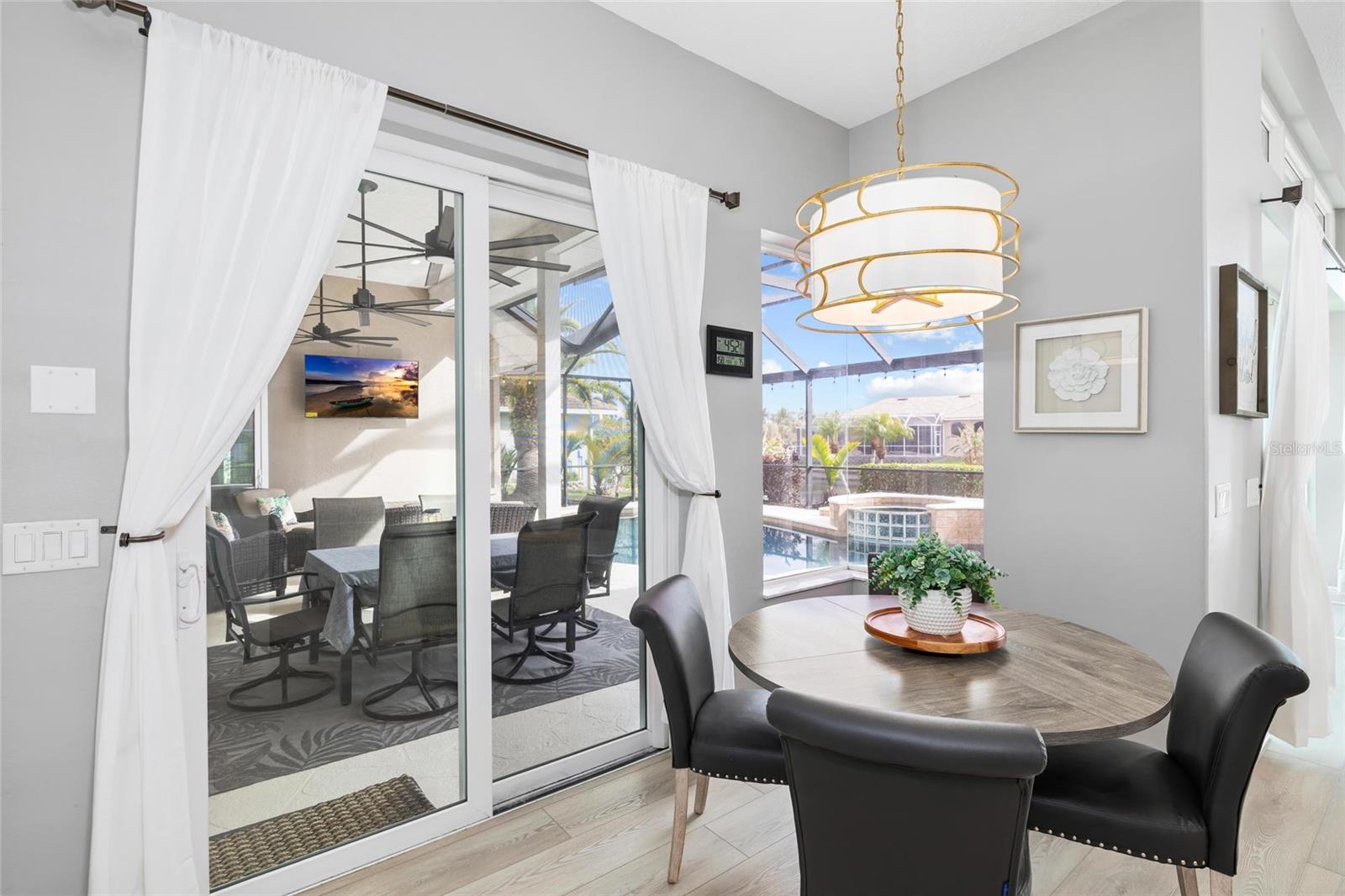 Dining Nook off of Kitchen with Sliders to Lanai/Pool