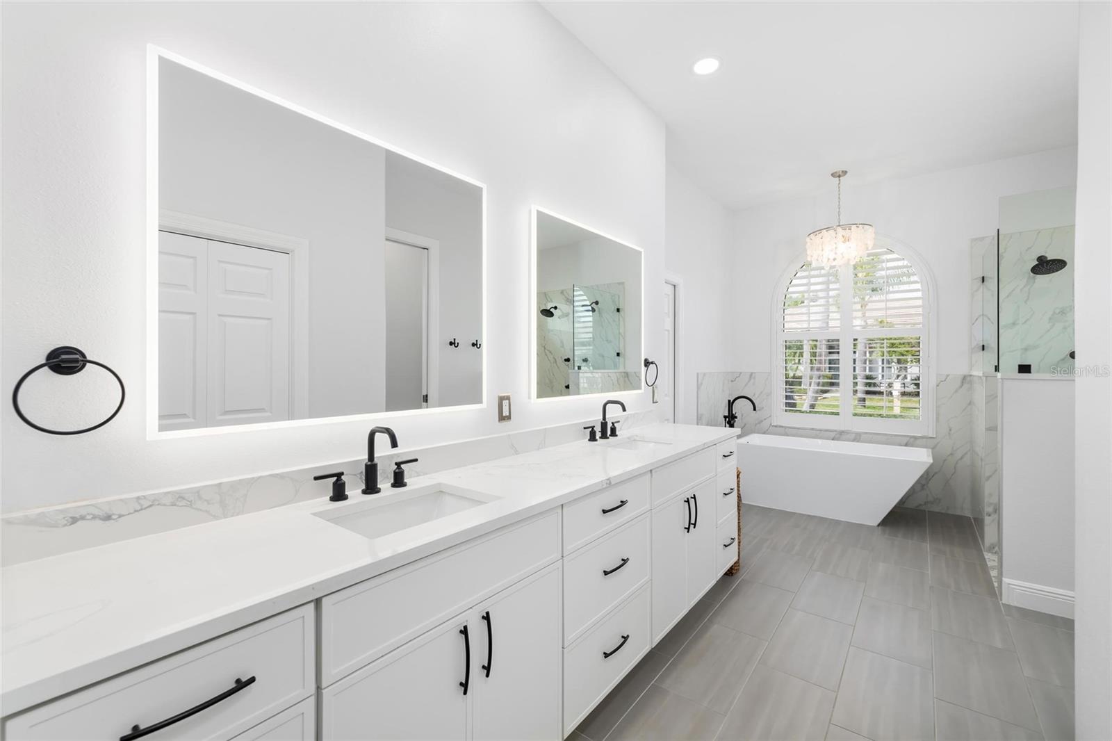 Ensuite Master Bathroom Featuring 3 Walk in Closets