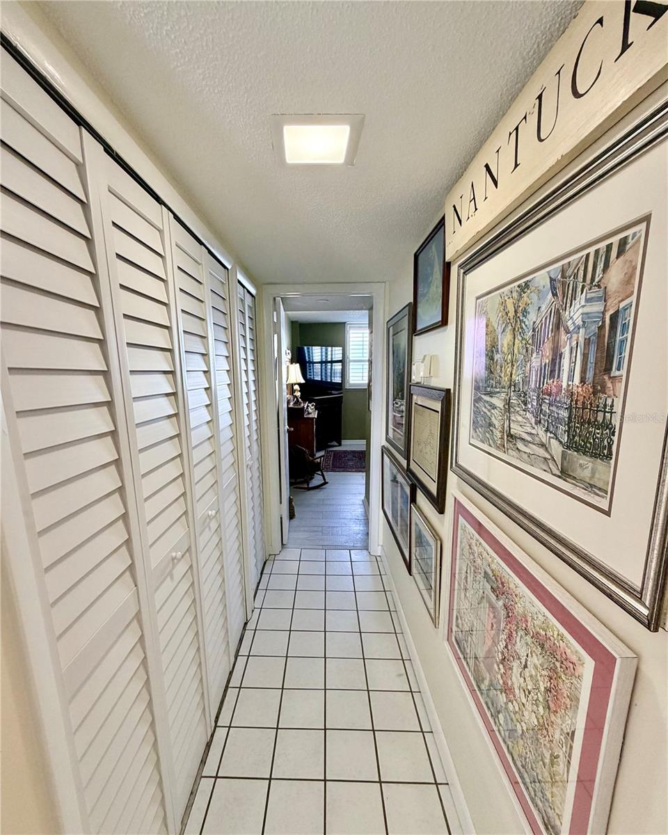 Hallway to Primary Laundry and Utility on Left