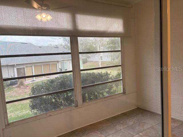 Covered and enclosed porch view from Living Room.