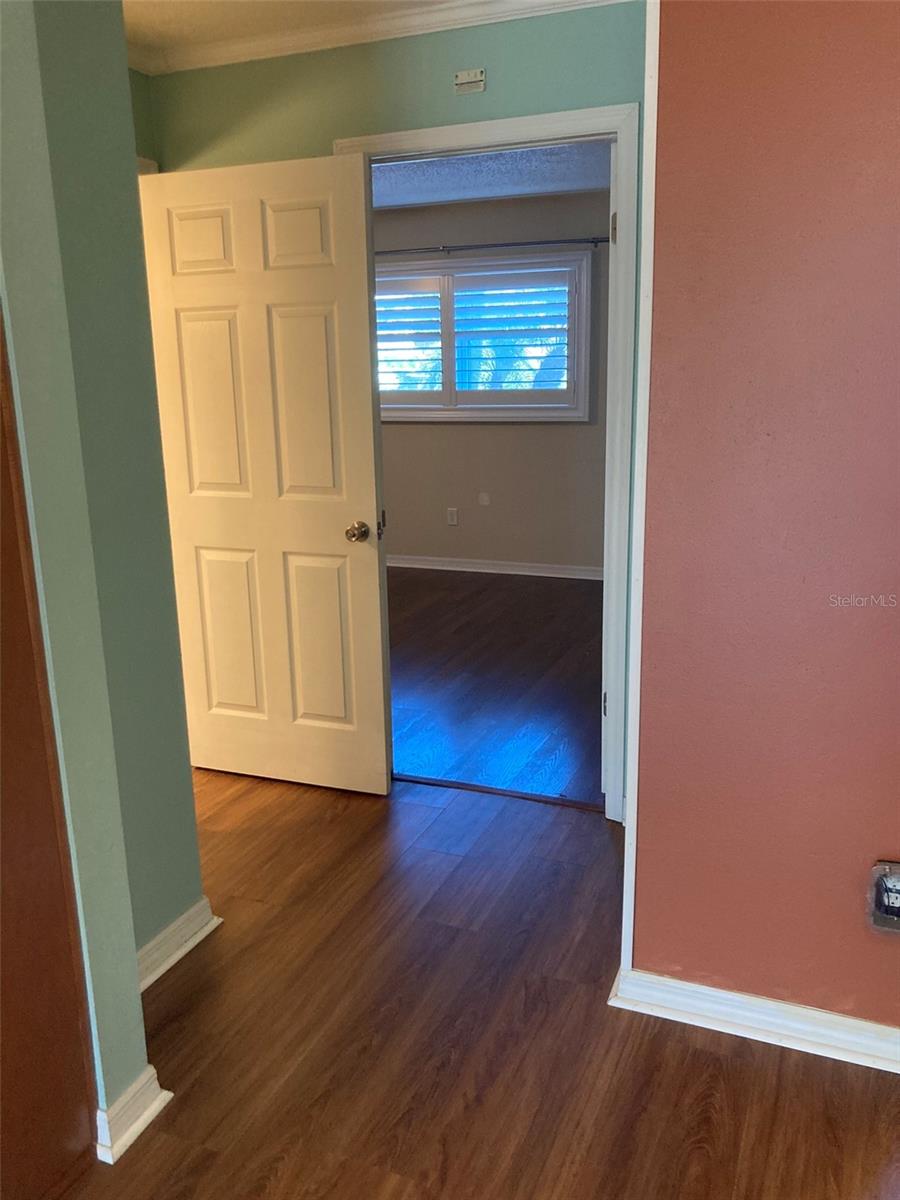 Hall way to bedroom and full bath