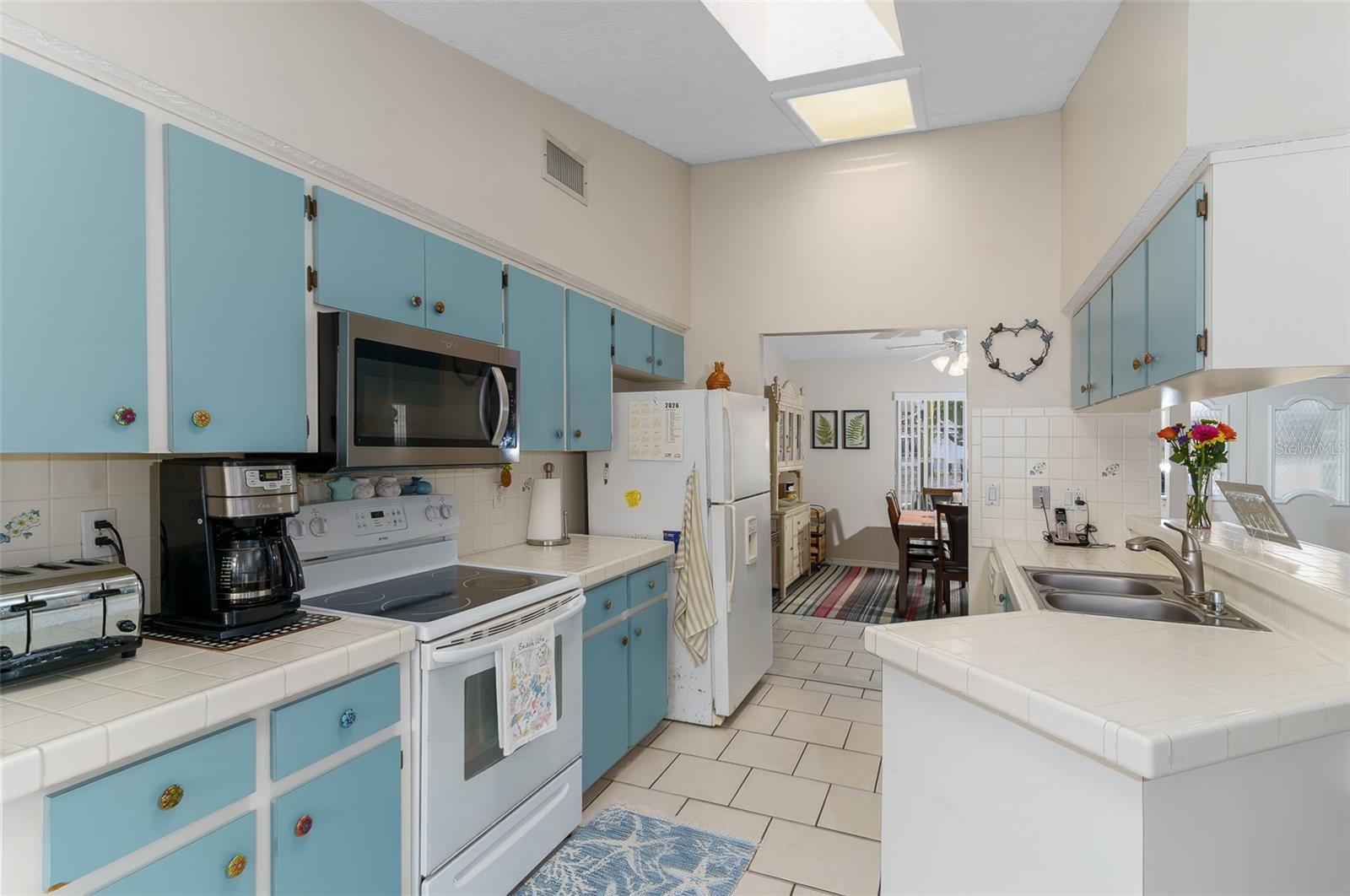 loads of cabinets, open to living room/dining room