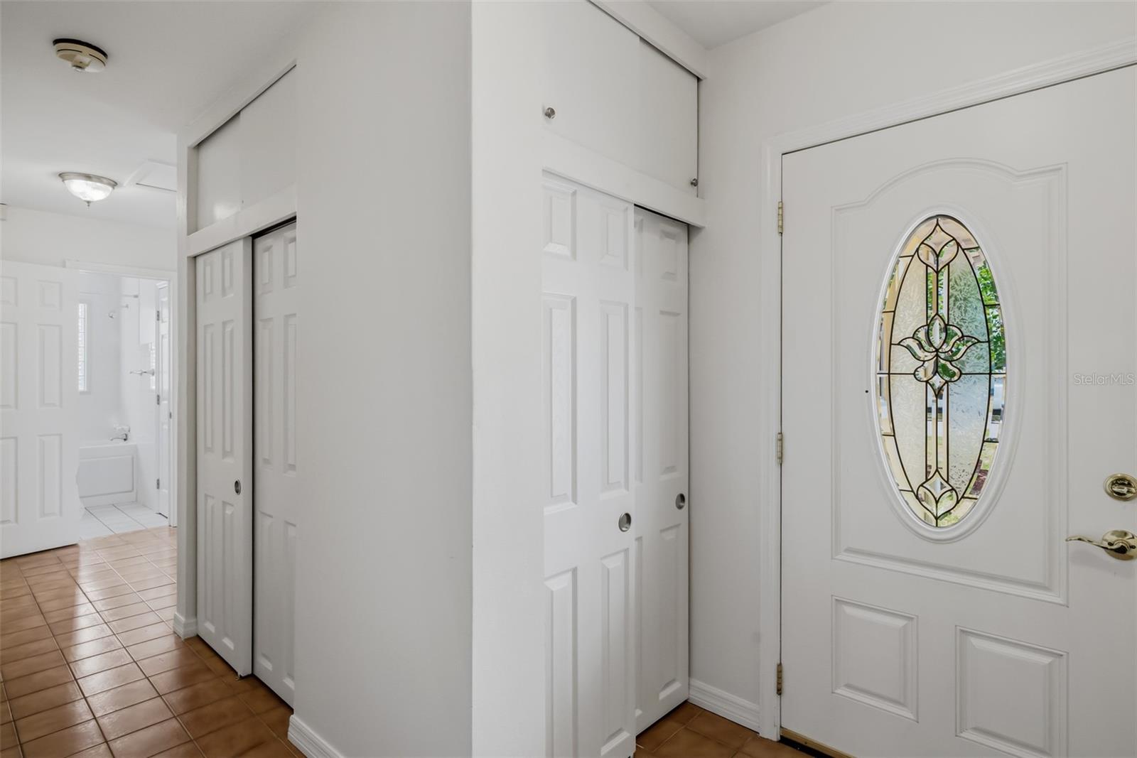 View of hallway looking toward bathroom two and bedrooms