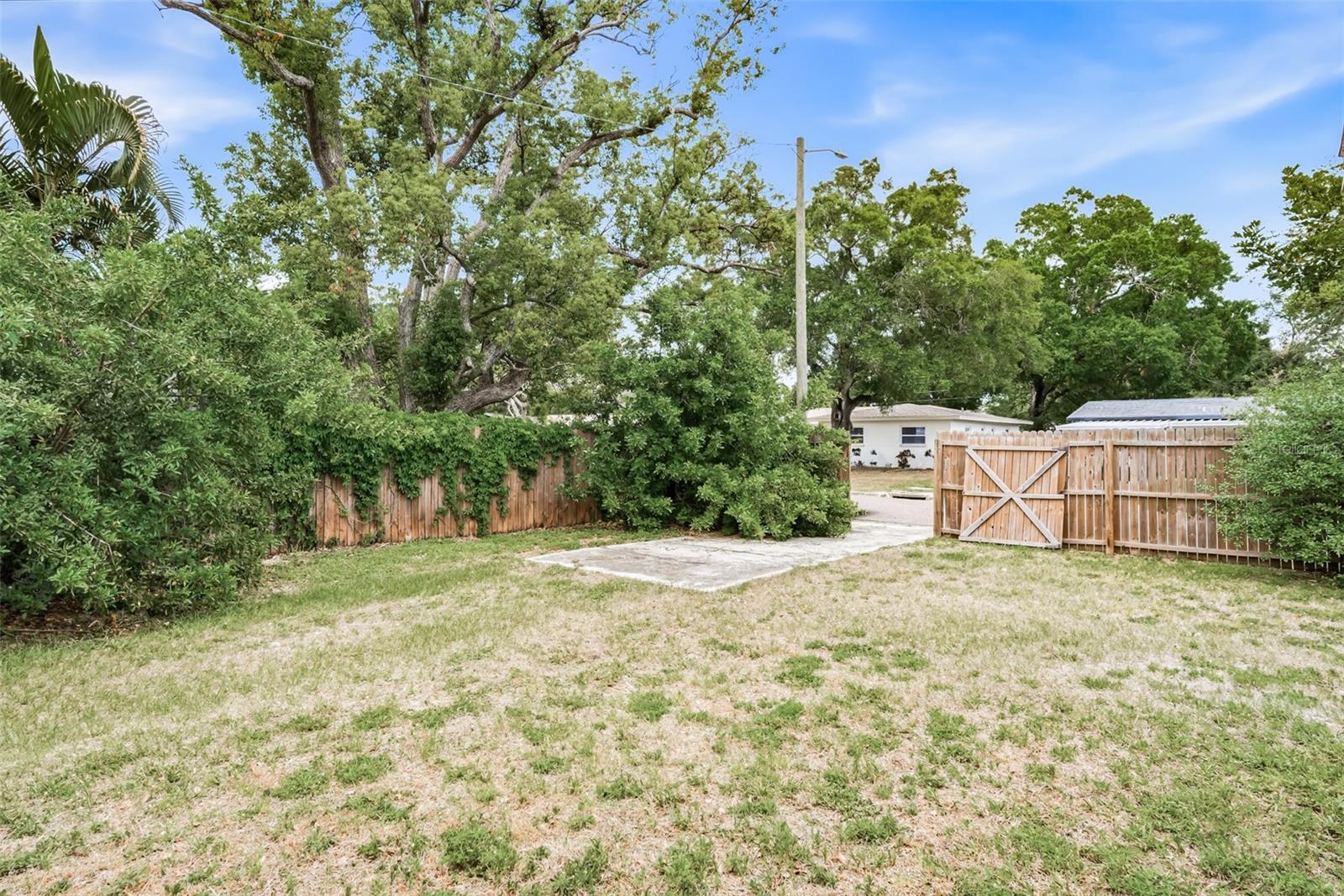 Gate on east side with concrete boat/vehicle pad