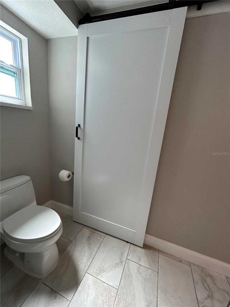 barn door inside bathroom