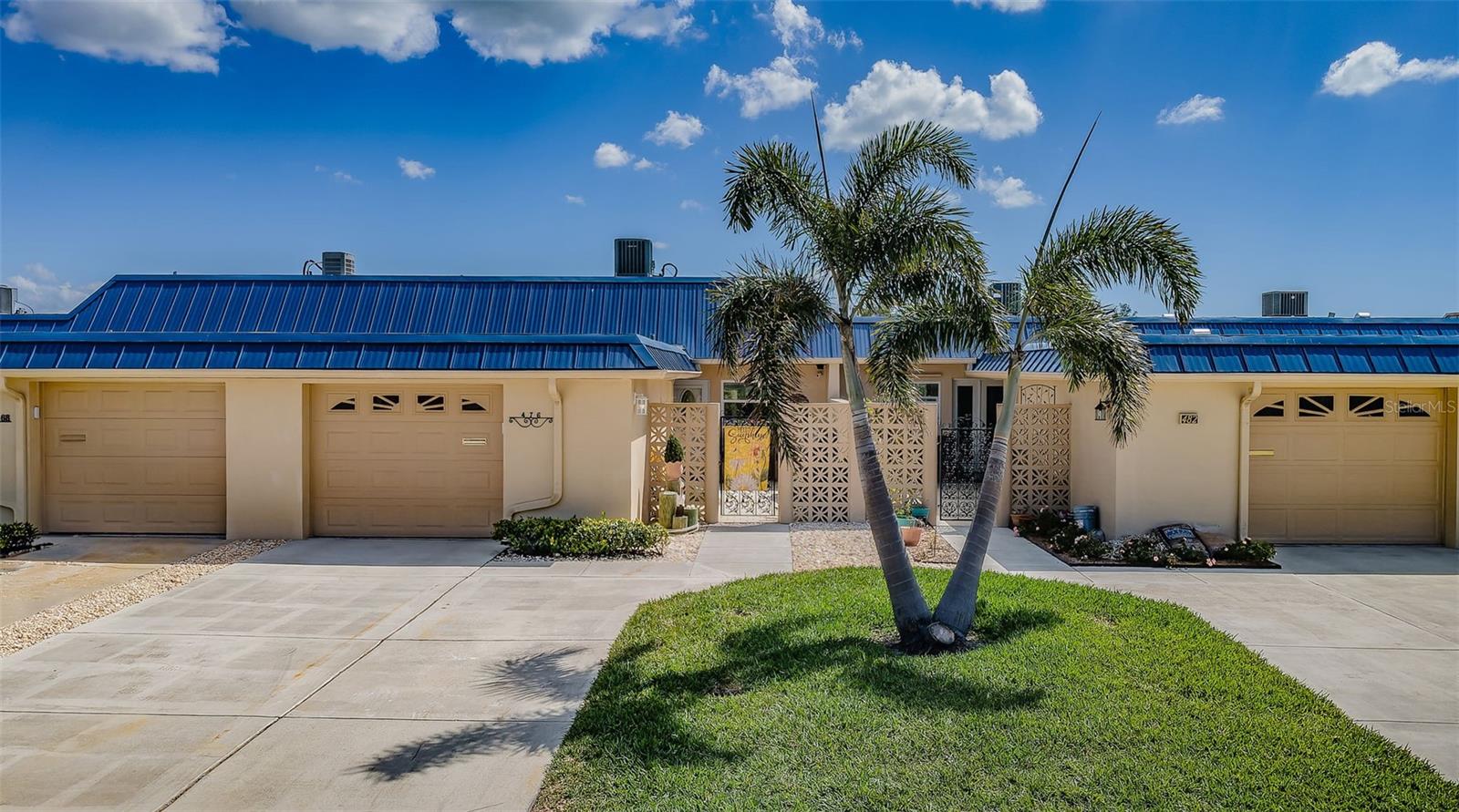 Street view of home with extra parking pad