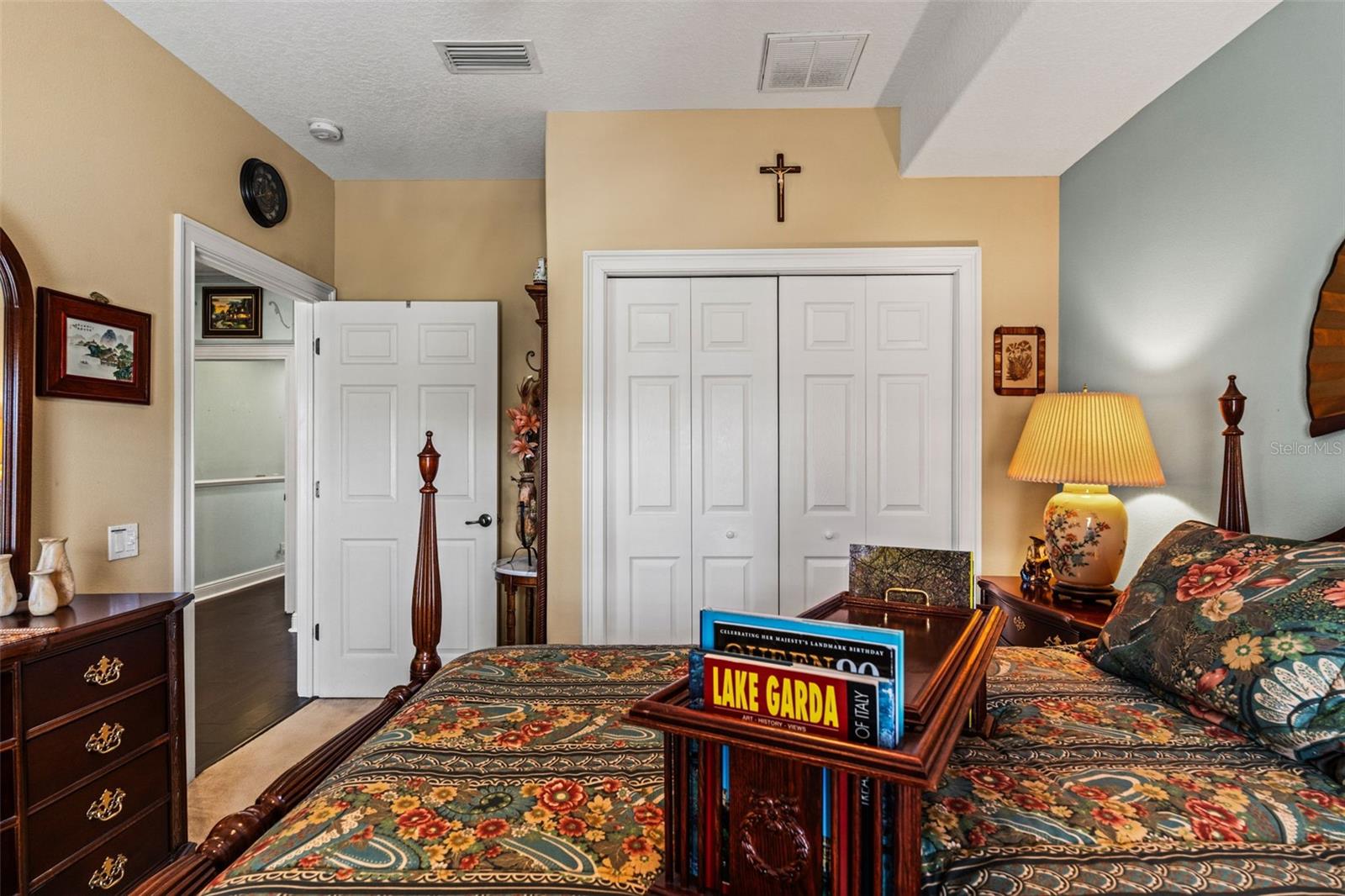 Spacious bedroom with large closet doors and easy access to the adjoining hallway.