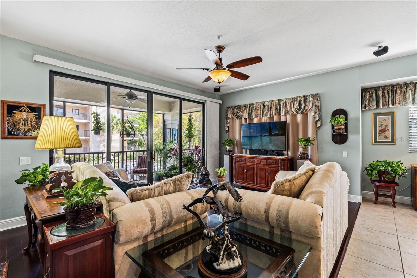 Inviting living space that opens directly to the screened balcony, offering seamless indoor-outdoor living.