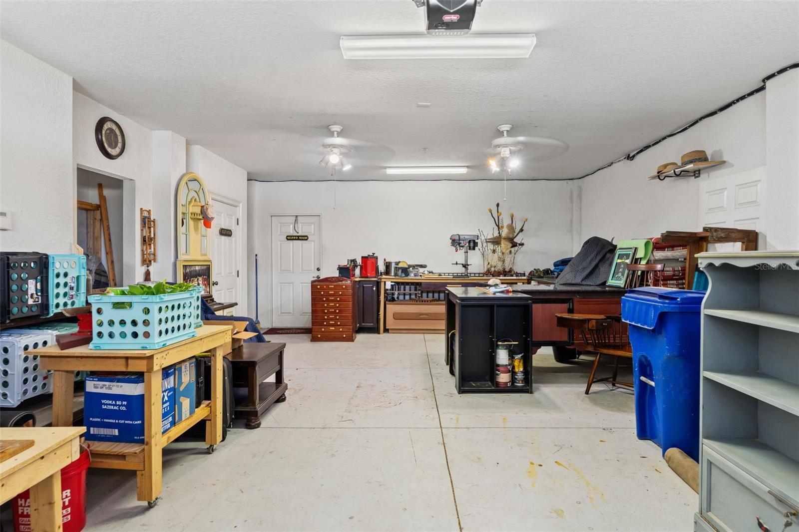 Large attached garage offering ample room for parking, storage, or a workshop setup.