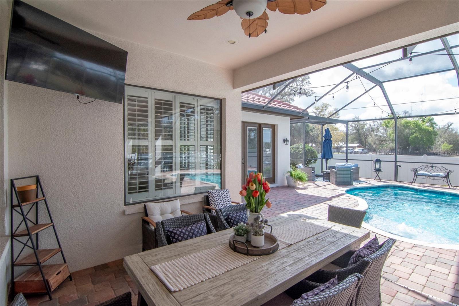 eating space on patio by pool