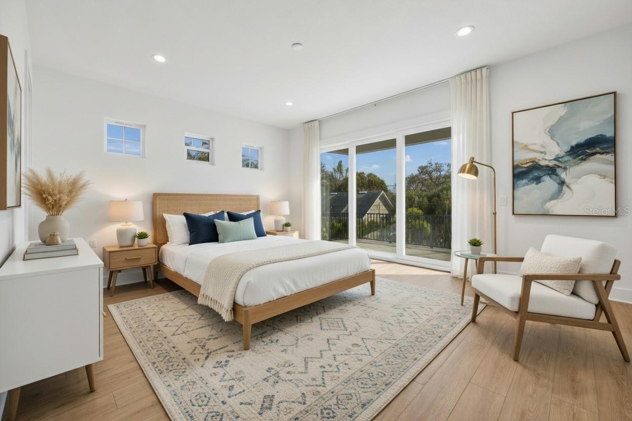 Primary suite with cascading sliders leading to patio deck