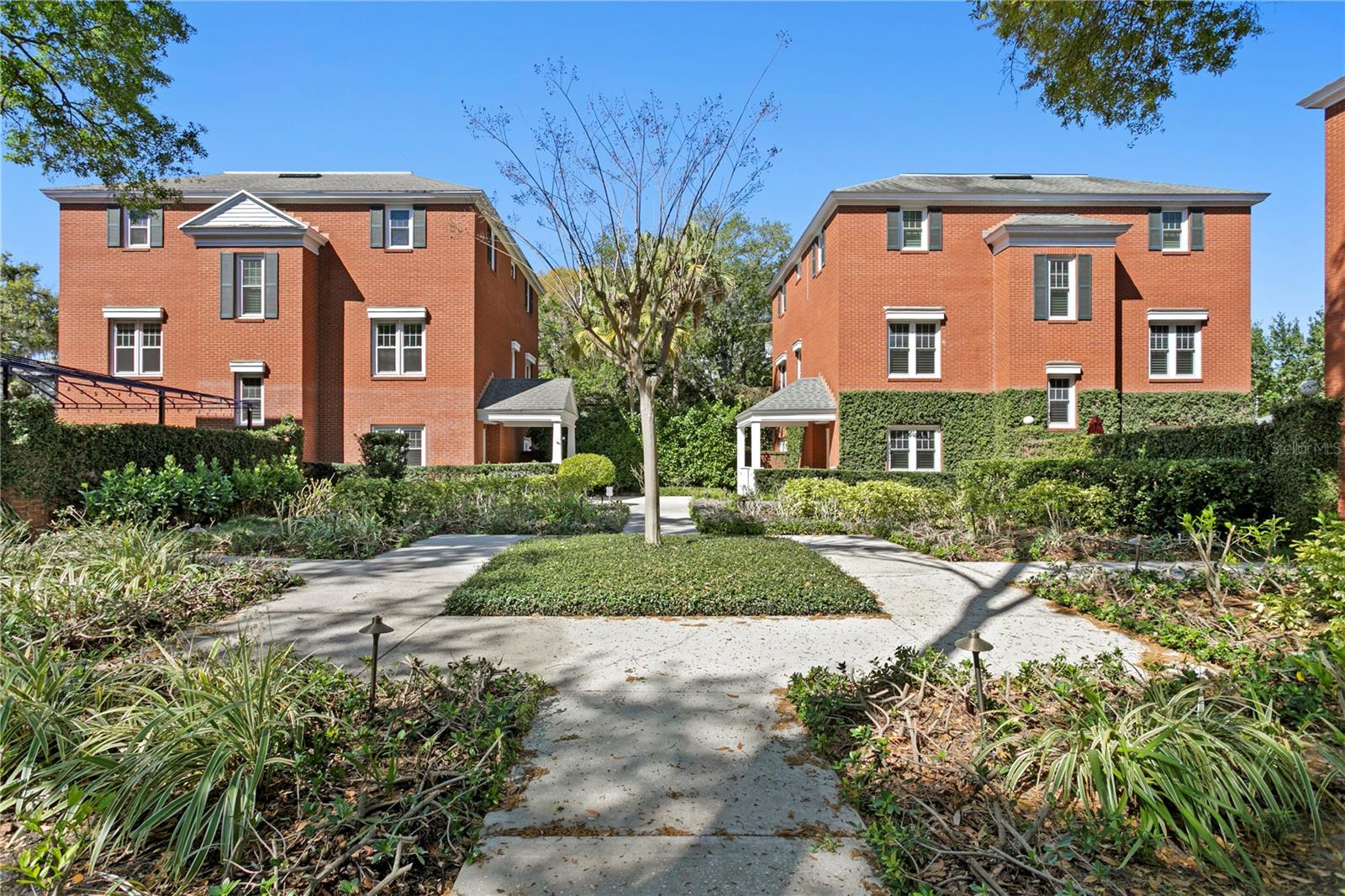 One of 4 brick homes in the privately gated enclave