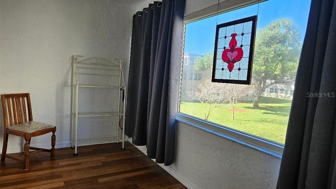 SIDE OF THE FLORIDA ROOM, STAINED GLASS DOES NOT STAY