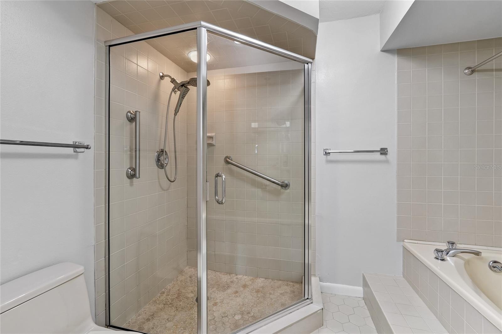 Primary En Suite Bathroom with tiled shower and jetted tubs