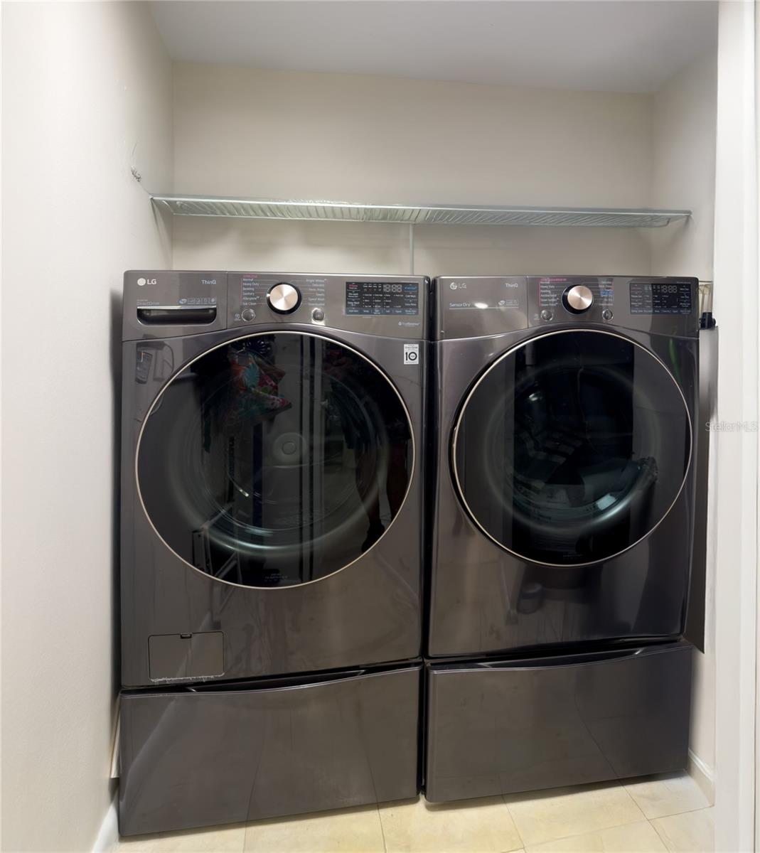 Laundry room with Newer Washer and Dryer that convey