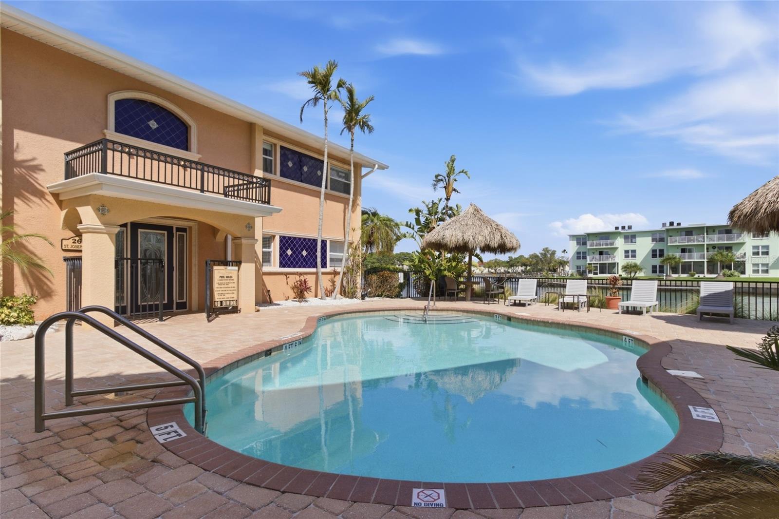 Pool, tiki huts and grilling area