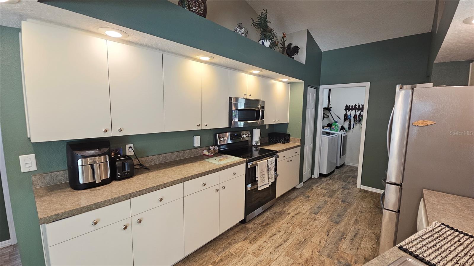 Open kitchen with high top breakfast bar