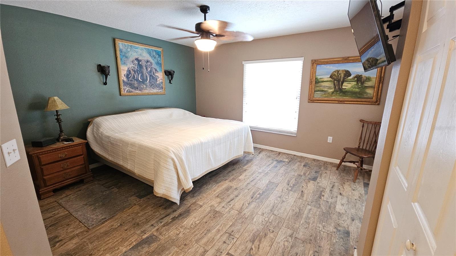 Master Bedroom with slider door to pool & patio