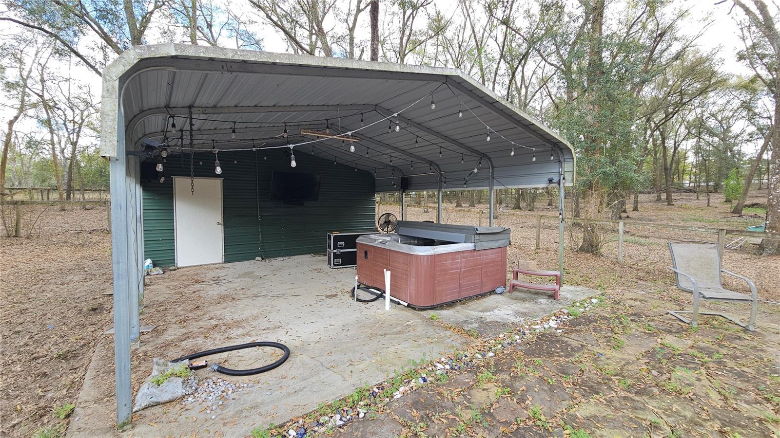 Covered area for entertaining or to shelter animals, complete w/ attached garage