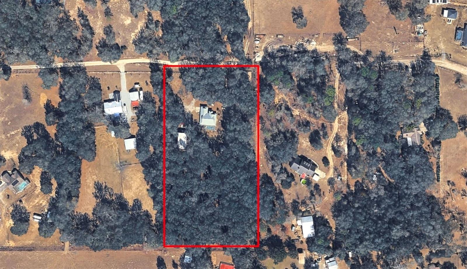 5.08 Acres fenced property for sale in Dade City, FL. Pool Home, metal building/shop, Equestrian Community